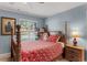 Charming bedroom featuring a full-size bed and wooden nightstand at 12760 Indian Rocks Rd # 510, Largo, FL 33774