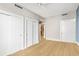 Bedroom boasts hardwood floors, modern ceiling fan, and multiple closet and door access at 1120 E Kennedy Blvd # 734, Tampa, FL 33602