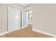 Hallway features hardwood floors, neutral paint, and access to a modern kitchen at 1120 E Kennedy Blvd # 734, Tampa, FL 33602