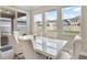 Bright dining area with white table and chairs, overlooking backyard at 9782 Coneflower Ct, Land O Lakes, FL 34637