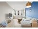 Living room boasts a sectional sofa and large windows at 1120 E Kennedy Blvd # 734, Tampa, FL 33602