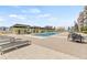 Community pool with surrounding patio furniture at 1120 E Kennedy Blvd # 734, Tampa, FL 33602