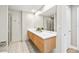 Elegant bathroom featuring dual sinks and a large mirror at 1120 E Kennedy Blvd # 734, Tampa, FL 33602
