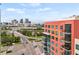 Exterior view of building with city skyline in background at 1120 E Kennedy Blvd # 734, Tampa, FL 33602