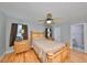 Bedroom with hardwood floors, ceiling fan, and ensuite bath at 8472 17Th N Way, St Petersburg, FL 33702