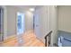 Hardwood floor hallway with access to bedrooms and bathroom at 8472 17Th N Way, St Petersburg, FL 33702