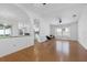 Living room with hardwood floors, open concept and kitchen view at 18203 Collridge Dr, Tampa, FL 33647