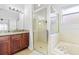 Bathroom with shower, tub, and granite countertop at 18203 Collridge Dr, Tampa, FL 33647