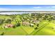 Aerial view of sprawling estate and a beautiful lake in the background at 10603 Low Oak Ter, Thonotosassa, FL 33592