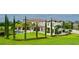 Lush backyard with mature trees, swimming pool, and manicured landscaping create a serene outdoor space at 10603 Low Oak Ter, Thonotosassa, FL 33592