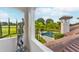 Balcony overlooking pool and lush landscaping at 10603 Low Oak Ter, Thonotosassa, FL 33592