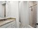 Bathroom featuring a glass enclosed shower, granite countertops and stylish tile flooring at 10603 Low Oak Ter, Thonotosassa, FL 33592
