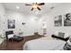 Bright bedroom with hardwood floors, ensuite bathroom, and ample natural light at 10603 Low Oak Ter, Thonotosassa, FL 33592