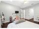 Bedroom with a vanity, hardwood floors, and ample natural light at 10603 Low Oak Ter, Thonotosassa, FL 33592