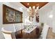 Formal dining room featuring a beautiful chandelier, artwork, and seating for eight at 10603 Low Oak Ter, Thonotosassa, FL 33592