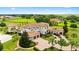 Expansive estate with manicured landscaping, circular driveway, and elegant Mediterranean architecture at 10603 Low Oak Ter, Thonotosassa, FL 33592
