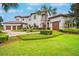 Beautiful home with a three car garage, brick driveway, and immaculate landscaping at 10603 Low Oak Ter, Thonotosassa, FL 33592