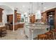 This spacious kitchen features custom cabinets, granite countertops, and a double island at 10603 Low Oak Ter, Thonotosassa, FL 33592