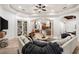 Spacious living room with a large sectional, open floor plan, and custom built-ins at 10603 Low Oak Ter, Thonotosassa, FL 33592