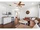 Cozy living room with a wet bar, hardwood floors, and comfortable seating at 10603 Low Oak Ter, Thonotosassa, FL 33592
