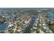 Aerial view of a charming residential neighborhood along a waterway with boat docks at 1661 Watermark Ne Cir # C, St Petersburg, FL 33702