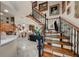 Grand foyer featuring a beautiful staircase, elegant decor, and an open floor plan at 1661 Watermark Ne Cir # C, St Petersburg, FL 33702