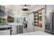Modern kitchen with stainless steel appliances, marble countertops, and a convenient wine rack at 1661 Watermark Ne Cir # C, St Petersburg, FL 33702