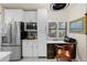 Well-equipped kitchen with stainless steel appliances, ample storage, and built-in desk area at 1661 Watermark Ne Cir # C, St Petersburg, FL 33702