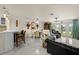 Open-concept living room with dining area and beautiful water views through large glass doors at 1661 Watermark Ne Cir, St Petersburg, FL 33702