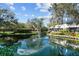 Beautiful pond with a fountain and lush landscaping in a serene community setting at 1661 Watermark Ne Cir # C, St Petersburg, FL 33702