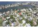 Neighborhood aerial view showcasing the lush landscaping, swimming pools, and the home's location at 411 Harbor View Ln, Largo, FL 33770