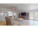 Cozy living room with plush seating and seamless access to the outdoor pool area at 411 Harbor View Ln, Largo, FL 33770