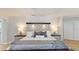Inviting bedroom boasts a decorative headboard, soft lighting, and a comfortable ambiance at 411 Harbor View Ln, Largo, FL 33770
