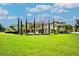 Back view of home showcasing pool and landscaping at 10603 Low Oak Ter, Thonotosassa, FL 33592