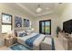 Beautiful bedroom features a sliding glass door and scenic view of the surrounding natural landscape at 15154 Appleton Blvd, Port Charlotte, FL 33981