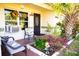 Front porch with seating, potted plants, and fall decorations at 2109 58Th S St, Gulfport, FL 33707