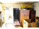 Cluttered garage with boxes, furniture, and various stored items at 2109 58Th S St, Gulfport, FL 33707