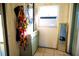 Narrow hallway with mirror and storage cabinet at 2109 58Th S St, Gulfport, FL 33707