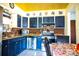 Kitchen with dark blue cabinets and brick backsplash at 2109 58Th S St, Gulfport, FL 33707