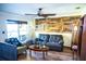 Living room featuring a brown sofa, a coffee table, and wood-look flooring at 2109 58Th S St, Gulfport, FL 33707