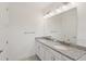 Bathroom featuring a double vanity with granite countertops and modern fixtures at 31907 Anchor Point Dr, Wesley Chapel, FL 33545