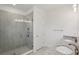 Bathroom showcasing a walk-in glass shower, granite countertops, and modern lighting at 31907 Anchor Point Dr, Wesley Chapel, FL 33545