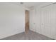 Bedroom featuring neutral carpet and two paneled doors at 31907 Anchor Point Dr, Wesley Chapel, FL 33545