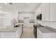 Beautiful new kitchen with white cabinetry, granite countertops, and stainless steel appliances at 31907 Anchor Point Dr, Wesley Chapel, FL 33545