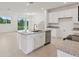 Bright kitchen with a large island, stainless steel appliances, and lots of counter space at 31907 Anchor Point Dr, Wesley Chapel, FL 33545