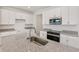 Close up of a kitchen island with stainless steel sink and goose neck faucet and granite countertops at 31907 Anchor Point Dr, Wesley Chapel, FL 33545