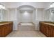 Elegant bathroom with a large soaking tub and double vanities at 4943 Sandy Brook Cir, Wimauma, FL 33598