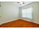 Spacious bedroom with hardwood floors and a large window at 4943 Sandy Brook Cir, Wimauma, FL 33598
