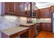 Kitchen boasts granite countertops and custom cabinetry at 4943 Sandy Brook Cir, Wimauma, FL 33598