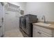 Laundry room with washer, dryer, and utility sink at 4943 Sandy Brook Cir, Wimauma, FL 33598
